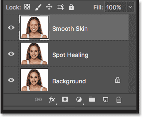 The original image, the Spot Healing layer and the Smooth Skin layer in the Layers panel in Photoshop